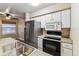 Modern kitchen features stainless steel appliances and granite countertops at 2670 E Otero Pl # 11, Centennial, CO 80122