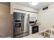 Modern kitchen features stainless steel appliances, granite countertops and white cabinets at 2670 E Otero Pl # 11, Centennial, CO 80122