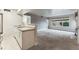 Open concept living room and kitchen area features neutral paint, carpet and lots of natural light at 2670 E Otero Pl # 11, Centennial, CO 80122