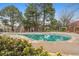 Sparkling community pool surrounded by lush landscaping and mature shade trees at 2670 E Otero Pl # 11, Centennial, CO 80122