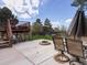 The backyard patio features a fire pit and seating area perfect for relaxing and entertaining outdoors at 416 Pluto Ct, Lone Tree, CO 80124