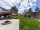 The property features a backyard with a fire pit, patio, grassy area, and a deck at 416 Pluto Ct, Lone Tree, CO 80124