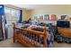 Bedroom with a bed, a chest freezer, and blue walls at 416 Pluto Ct, Lone Tree, CO 80124