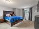 Spacious bedroom featuring carpet flooring, and a large window providing natural light at 416 Pluto Ct, Lone Tree, CO 80124