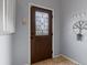 Inviting entryway with a decorative glass front door, tiled flooring and a coat rack for added convenience at 416 Pluto Ct, Lone Tree, CO 80124