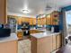 Well-equipped kitchen featuring stainless steel appliances, wood cabinets, and lots of counter space at 416 Pluto Ct, Lone Tree, CO 80124
