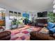 Spacious living room with fireplace, large TV, and hardwood floors, perfect for entertaining at 416 Pluto Ct, Lone Tree, CO 80124