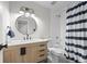 Updated bathroom boasts new vanity with wooden cabinets and modern fixtures at 23551 Genesee Village Rd # H, Golden, CO 80401