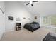 Cozy bedroom with vaulted ceilings, ceiling fan, and natural light from large window at 23551 Genesee Village Rd # H, Golden, CO 80401