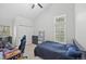 This bedroom offers a vaulted ceiling, large windows, and plenty of space at 23551 Genesee Village Rd # H, Golden, CO 80401