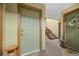 Building entry with staircase and interior doors at 23551 Genesee Village Rd # H, Golden, CO 80401