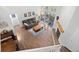Spacious living room with wood floors, fireplace, and sliding doors to the outside patio at 23551 Genesee Village Rd # H, Golden, CO 80401