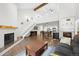 Open living space featuring stairs, fireplace, and kitchen and dining area at 23551 Genesee Village Rd # H, Golden, CO 80401