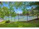 Tennis courts surrounded by lush trees, offering a scenic and active recreational area for residents at 23551 Genesee Village Rd # H, Golden, CO 80401
