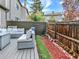 Serene backyard featuring an outdoor patio with stylish seating, enhanced by beautiful landscaping at 3529 S Telluride Cir # D, Aurora, CO 80013