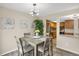 Inviting dining area next to the kitchen featuring a modern chandelier and open layout at 3529 S Telluride Cir # D, Aurora, CO 80013