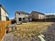 Spacious backyard with a patio area and wooden fence providing privacy at 25206 E Lake Dr, Aurora, CO 80016