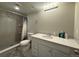 Updated bathroom features a shower, vanity, and modern lighting at 25206 E Lake Dr, Aurora, CO 80016
