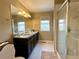 Bathroom featuring a granite countertop, and glass enclosed shower at 25206 E Lake Dr, Aurora, CO 80016