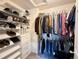 Organized walk-in closet with shelving and hanging rods at 25206 E Lake Dr, Aurora, CO 80016