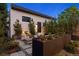 Cozy backyard seating area with lush landscaping, modern planters, and integrated lighting for evening enjoyment at 2248 S Lincoln St, Denver, CO 80210