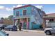 Quaint building with colorful mural and storefront windows at 2248 S Lincoln St, Denver, CO 80210