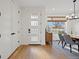 Bright entryway with stylish front door, hardwood floors, and dining area at 2248 S Lincoln St, Denver, CO 80210