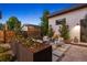 Cozy outdoor patio featuring modern furniture, stone pavers, and vibrant plants at 2248 S Lincoln St, Denver, CO 80210