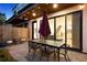 Outdoor patio featuring a dining area with overhead lighting, perfect for evening entertainment and relaxation at 2248 S Lincoln St, Denver, CO 80210