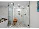 Contemporary shower featuring herringbone tile, a glass enclosure, and a built-in bench at 2248 S Lincoln St, Denver, CO 80210