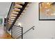 Modern staircase with wood treads, black railing, and contemporary design at 2248 S Lincoln St, Denver, CO 80210