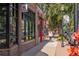 Brick building along a street with pedestrian traffic and storefronts at 2248 S Lincoln St, Denver, CO 80210