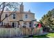 Fenced-in back yard with a patio, space to grill, and a well-maintained lawn at 9565 W Coal Mine Ave # A, Littleton, CO 80123