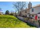 Well maintained back yard showing a beautiful lawn and privacy fence at 9565 W Coal Mine Ave # A, Littleton, CO 80123