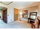 Bedroom with neutral colors, storage closet and decorative poster at 9565 W Coal Mine Ave # A, Littleton, CO 80123