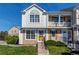 Well-maintained townhouse exterior showcasing detailed architectural elements and a neatly landscaped front yard at 9565 W Coal Mine Ave # A, Littleton, CO 80123