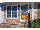 Charming front entrance with stone accents and a decorative security door at 9565 W Coal Mine Ave # A, Littleton, CO 80123