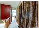 Upstairs hallway with decorative curtains and view of Primary bedroom at 9565 W Coal Mine Ave # A, Littleton, CO 80123