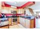 Kitchen featuring stainless steel appliances, light wood cabinets, and granite counter tops at 9565 W Coal Mine Ave # A, Littleton, CO 80123