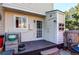 Comfortable patio area including space to sit, a back door and access to a fenced yard at 9565 W Coal Mine Ave # A, Littleton, CO 80123