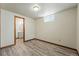 Finished basement area with a view into the bathroom at 1354 S Macon St, Aurora, CO 80012
