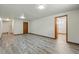 Open basement area featuring plank flooring and bright lighting at 1354 S Macon St, Aurora, CO 80012