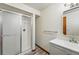 Bathroom featuring a glass-enclosed shower and modern vanity with updated hardware at 1354 S Macon St, Aurora, CO 80012
