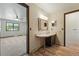 Bathroom sink and vanity with a view into the bedroom at 1354 S Macon St, Aurora, CO 80012