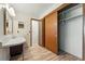 Bathroom featuring a sink, closet, and toilet area at 1354 S Macon St, Aurora, CO 80012