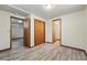 Spacious bedroom featuring neutral walls, plank flooring, and ample closet space at 1354 S Macon St, Aurora, CO 80012