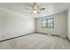 Bright bedroom featuring neutral carpeting and a window at 1354 S Macon St, Aurora, CO 80012
