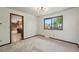 Bright dining area featuring neutral carpet and a window offering natural light at 1354 S Macon St, Aurora, CO 80012