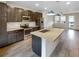 Modern kitchen with island, stainless steel appliances, and dark cabinetry at 11267 Central Ct, Broomfield, CO 80021