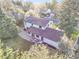 Aerial view of the home featuring solar panels and a landscaped backyard at 3930 S Hillcrest Dr, Denver, CO 80237